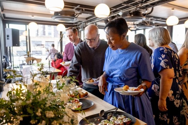Guests sharing a meal at a private Hudson Table event