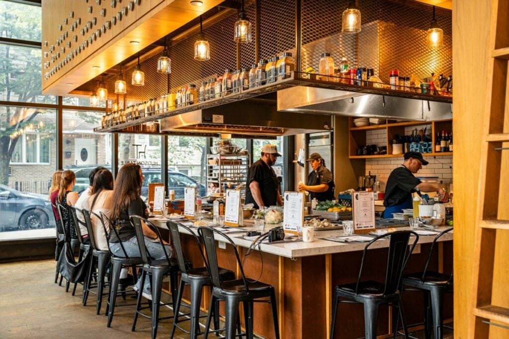 Guests at a Hudson Table Brooklyn private event in the open kitchen