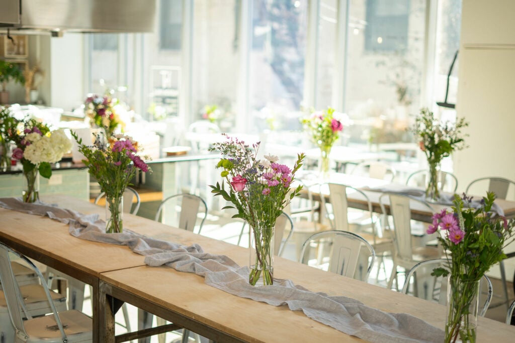 Floral arrangements on dining tables at Hudson Table Philadelphia