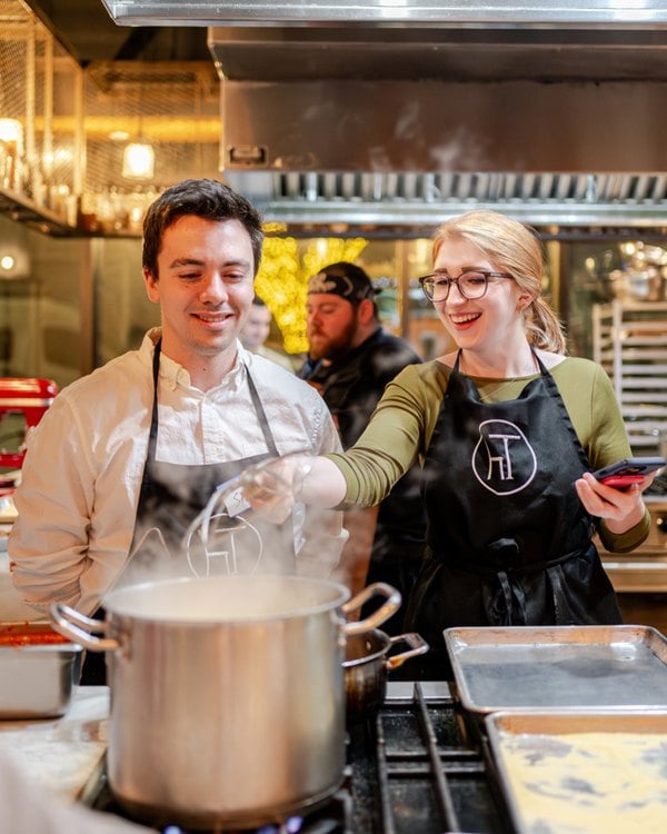 Guests cooking together at Hudson Table